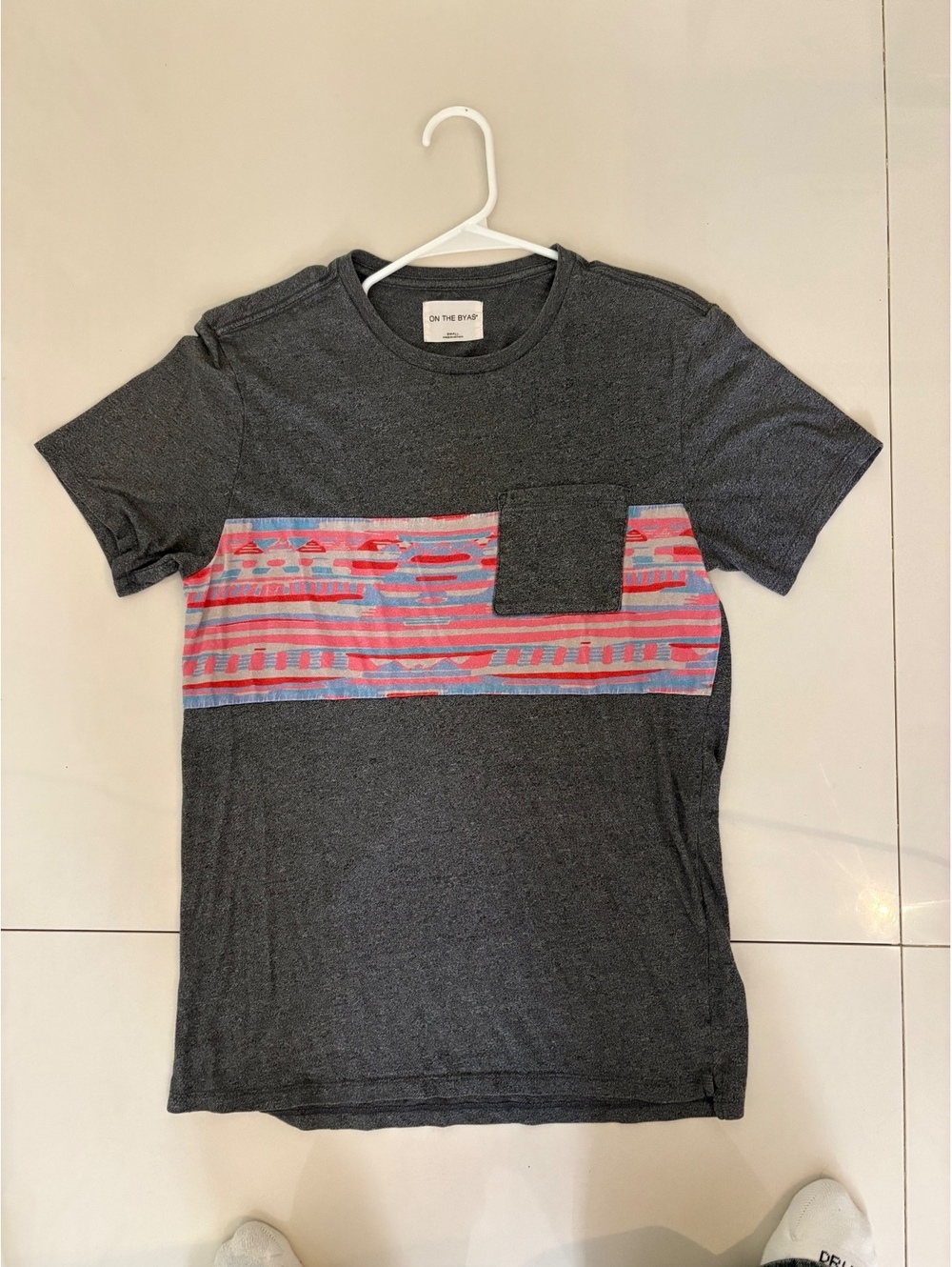 On the byas pattern pocket tee